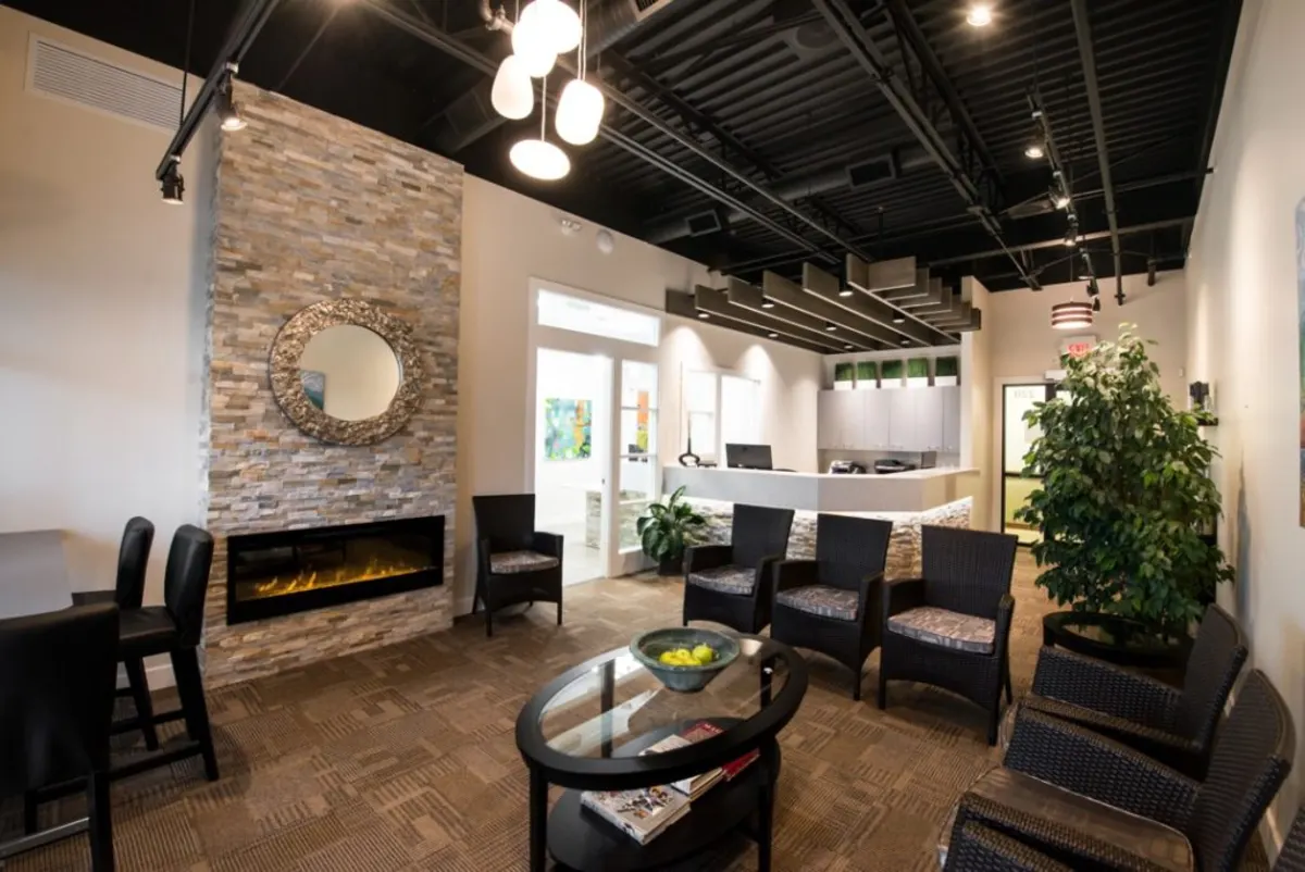 Crown Isle Dental waiting area with fireplace and comfortable seating